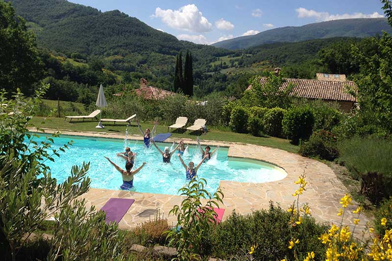 A group enjoying some pool Pilates in the pool