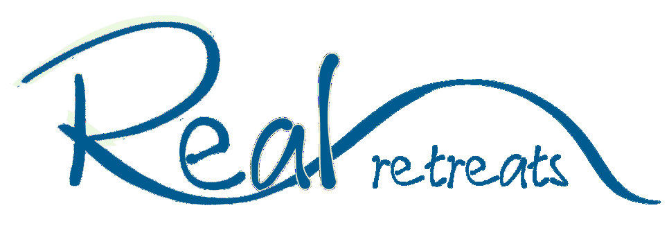 Real retreats logo in blue